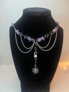 A beaded necklace decorated with amethyst crystal chunks, black beads, a mushroom charm and a sun charm. Purple Festival Jewelry With Black Beads, Purple Jewelry With Black Beads For Festival, Necklace Inspo Beads, Gothic Jewelry Diy, Diy Jewelry Projects, Sun Charm, Diy Jewlery, Sun Necklace, Fairy Jewelry