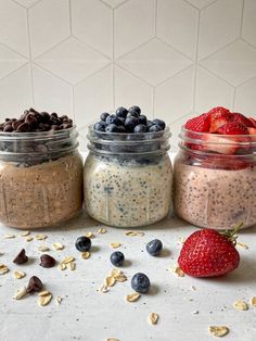 three jars filled with different types of food