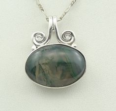 "Gorgeous green moss agate cabochon in a vintage sterling silver pendant. Marked \"925\". 18\" inch sterling silver chain included! A wonderful addition to your personal jewelry collection. FREE Domestic Shipping! Details: Sterling Silver: (as shown in photo) Moss Agate: cabochon Approximate Pendant Dimensions: 1 1/4 inch x 1 inch Chain Length: 18 inches Total Weight: 12.7 grams FREE Domestic Shipping by USPS Priority Mail Signature Confirmation and includes insurance. If the item is to be shipp Silver Moss Agate Jewelry With Cabochon, Silver Moss Agate Cabochon Jewelry, Green Moss Agate Oval Jewelry, Green Oval Moss Agate Jewelry, Mail Signature, Personal Jewelry, Green Moss Agate, Blue Sodalite, Agate Cabochon