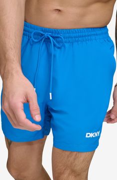 Soak up the sun in these recycled-fiber swim trunks built with UPF 40+ sun protection. 5" inseam (size Medium) Elastic/drawstring waist Front slant pockets; back patch pocket Lined 100% REPREVE polyester REPREVE recycled polyester is made from 100% post-consumer recycled plastic bottles Machine wash, tumble dry Imported Sporty Blue Swim Trunks For Vacation, Blue Beachwear Swimwear For Outdoor, Blue Beachwear For Outdoor, Blue Swim Trunks For Summer Outdoor, Blue Swimwear For Outdoor Summer Activities, Casual Lightweight Blue Swimwear, Blue Short Length Swimwear For Outdoor, Blue Nylon Swim Trunks With Upf 50+, Blue Nylon Swim Trunks For Summer