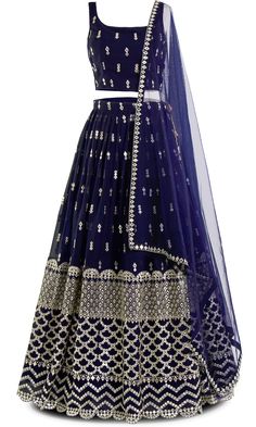 Navy never looked so fly! With mirror work that shines brighter than diamonds, this 3 piece lehenga screams elegance. Get ready to slay, because this lehenga doesn't just turn heads, it stops traffic. Elegant Party Lehenga With Gota Work, Festive Party Wear Salwar Kameez With Cutdana, Party Wear Festive Sharara With Gota Work, Festive Party Wear Sharara With Gota Work, Elegant Sequined Lehenga For Festivals, Bollywood Style Sequined Lehenga In Chinon, Bollywood Lehenga With Sequins In Traditional Drape, Bollywood Style Lehenga With Sequins, Elegant Designer Zari Work Skirt Set