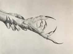 two hands holding each other over a piece of paper that has been drawn on it