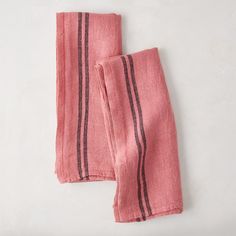 two pink towels folded on top of each other