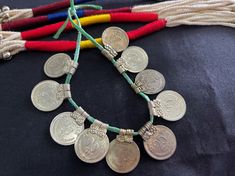 These extremely beautiful ethnic looking 25 paise coins are old looking Indian banjara metal charms for your ethnic jewelry. They are silver in color and very light in weight. They're approx. 19 mm in diameter and it's length is 23 mm approx. You will receive a set of 10 pieces. Bohemian Coin Necklace For Festivals, Handmade Traditional Coin Necklace, Traditional Handmade Coin Necklace, Traditional Coin Pendant Necklace For Festivals, Bohemian Jewelry With Motifs For Puja, Traditional Silver Coin Necklace For Festivals, Scrapbook Embellishments Diy, Cowry Shell, Embellishment Diy