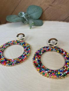 Hand beaded hoops with assorted glass beads. Earring setting is high quality gold plated brass.  Earring lengths are 4.5 inches Earring widths are 2.5 inches Brass Earring, Beaded Hoops, Hand Beading, Confetti, Jewelry Earrings Dangle, Etsy Earrings, Glass Beads, Dangle Drop Earrings, Dangle Earrings