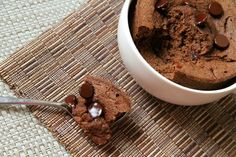 a bowl of chocolate ice cream and a spoon