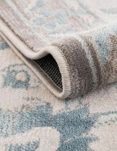 a close up view of the corner of a rug