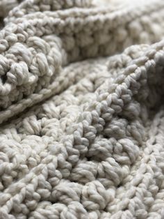 the texture of a blanket is made up of thick yarns and crochet