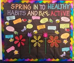 a bulletin board with flowers and bugs on it that says spring in to healthy habitats and be active