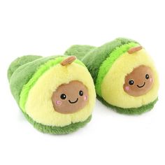 a pair of green and yellow slippers with smiling faces