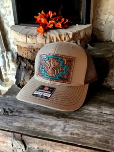 Mid trucker hat with one of a kind tooled leather patch. Patch features scroll work and Aztec. Hat is SnapBack adjustable and is khaki tan and coffee brown in color. PLEASE READ: This item is for pre-ordering, and is made to order! Once purchased, this item will take approximately two weeks to re-create. Item will be a close replica, but each one will have slight variances in color, carving, etc. as I am not perfect, and leather is not perfect either! Western Style Baseball Cap With Short Brim, Western Style Snapback Hat With Short Brim, Adjustable Brown Western Baseball Cap, Brown Adjustable Western Baseball Cap, Western Style Adjustable Brown Baseball Cap, Western Style Brown Adjustable Baseball Cap, Western Style Brown Flat Bill Baseball Cap, Western Brown Snapback Hat, Brown Western Snapback Hat