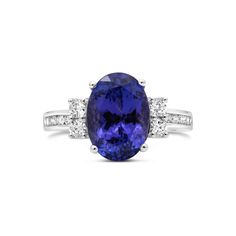 Metal: 14K White Gold Gemstones: 5.50 Cts. Tanzanite 0.45 Cts. Diamond