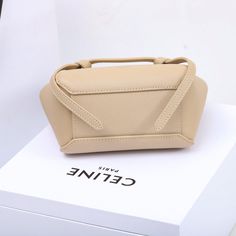 Size: 15cm*13cm*9cm It comes with Dust box, Care manual, Tag, and Paper bag. Trendy Square Bucket Bag As Gift, Trendy Rectangular Bucket Bag For Gift, Rectangular Large Capacity Bucket Bag As Gift, Modern Rectangular Pouch With Large Capacity, Modern Square Mobile Phone Box Bag, Large Capacity Top Handle Box Bag As Gift, Beige Top Handle Box Bag With Large Capacity, Beige Rectangular Bucket Bag With Top Carry Handle, Modern Rectangular Shopping Pouch