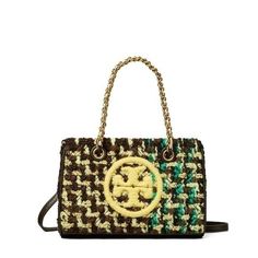 Embrace Fashion And Practicality By Carrying The Tory Burch Fleming Soft Tweed Mini Chain Tote. Crafted In Colorful Tweed, The Bag Has A Bridge With Magnetic Snap Closure And An Adjustable Crossbody Strap. Finished With An Embroidered Double T, The Feminine Bag Has A Chain And Leather Interwoven Top Grab Handles. Interior Hanging Pocket. Quilting Technique. Leather Trims And Base. Tory Burch Fleming, Tory Burch Purse, Tory Burch Tote, Compact Bag, Designer Crossbody Bags, Tory Burch Bag, Branded Handbags, Mini Tote, Green Bag