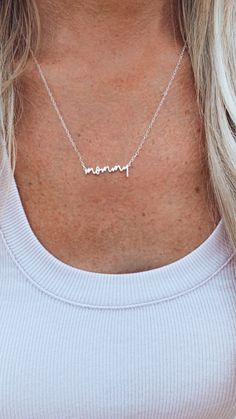 "A personalized mommy necklace that can be made in sterling silver, gold or rose gold. If you would like a different word or name we can make any word or name you would like! We also show an example of the necklace made with \"mama\" but again we can do any word or name. DETAILS Metal: Solid sterling silver, gold or rose gold options Width: 1.25\" Chain: 16\", 18\", or 20\" chain PERSONALIZATION If you would like a different word or name please write the word/name you would like in the personali Sterling Silver Charm Necklace For Mother's Day, Personalized Mother's Day Name Necklace, Meaningful Silver Name Necklace For Mother's Day, Silver Meaningful Name Necklace For Mother's Day, Silver Minimalist Name Necklace For Mom, Silver Minimalist Name Necklace As Gift For Mom, Meaningful Silver Custom Name Necklace, Personalized Sterling Silver Name Necklace For Mom, Customizable Sterling Silver Charm Necklace For Mother's Day