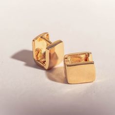 Measurements: Gold Cube huggies: 7mm wide Single row cz huggies: 12mm outer diameter Closure: Gold Cube huggies: huggie clasp Single row cz huggies: huggie clasp Materials: 18k gold layered, AAA+ Cubic Zirconia Package is beautifully wrapped and gift ready! Everyday Huggie Clip-on Earrings, Hypoallergenic Huggie Earrings, Everyday Yellow Gold Clip-on Huggie Earrings, Everyday Clip-on Huggie Hoop Earrings, Everyday Clip-on Huggie Earrings, Hypoallergenic Huggie Cartilage Earrings, Minimalist Huggie Clip-on Earrings For Gift, Minimalist Huggie Clip-on Earrings As Gift, Clip-on Huggie Earrings As Gift