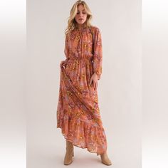 Floral Print Tiered Maxi Dress -Floral Print -Tiered Detail -Maxi Dress -Elastic At The Waist, Cuff, And Neck -Ruffle At Neck -Shirring Detail Fall Floral Print Orange Maxi Dress, Orange Floral Print Long Sleeve Maxi Dress, Flowy Orange Maxi Dress For Fall, Red Floral Print Maxi Dress For Fall, Orange Floral Print Casual Midi Dress, Flowy Orange Fall Dress, Flowy Orange Dress For Daywear, Orange Midi Dress For Fall Daywear, Spring Orange Maxi Dress