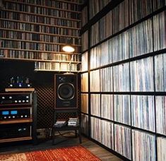 a room filled with lots of different types of records and audio equipment on shelves next to each other