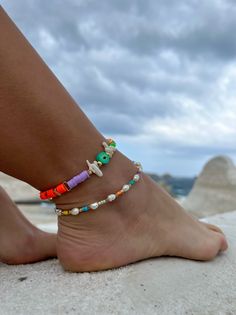 Add a touch of unique style to your summer wardrobe with these stunning handmade ankle bracelets! Trendy Festival Anklets With Colorful Beads, Trendy Colorful Beads Anklets For Festival, Trendy Beaded Festival Anklets, Handmade Beaded Bracelets For Summer Festival, Trendy Beaded Anklets For Festival, Bohemian Colorful Beads Anklet For Vacation, Multicolor Tiny Beads Bracelets For Beach Season, Multicolor Tiny Beads Bracelet For Beach Season, Trendy Beaded Anklets For Vacation