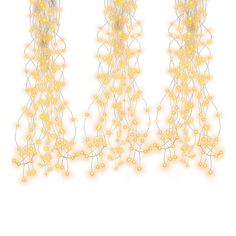 three yellow string lights hanging from the side of a white wall with small beads on them