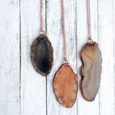 "Agate slice necklace | Large agate necklace | Raw agate pendant | Agate slice pendant | Natural agate necklace | Natural stone necklace This listing is for one large agate slice pendant electroformed in copper and strung on a 30\" copper cable chain. This necklace does not have a clasp. It is designed to slip on over the head. Our jewelry is unique and one-of-a-kind. Please note there will likely be variances in the size, shape and color of each stone. All elements of your piece are handcrafted Agate Necklace With Large Round Pendant, Agate Pendant Necklace With Large Stone, Adjustable Agate Necklace With Raw Stone, Long Agate Crystal Necklace Gift, Long Agate Crystal Necklaces As Gift, Agate Necklace With Large Pendant, Agate Oval Pendant Necklaces For Jewelry Making, Agate Necklace With Raw Stone For Gift, Agate Large Pendant Necklace