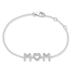 A heartfelt gift, this bracelet features a charm that displays "Mom" in sparkling white lab-created sapphires. Styled in classic sterling silver, the cable chain measures 7.5 inches and secures with a lobster clasp. Mom Bracelet, White Lab, Moms Bracelet, Kay Jewelers, Bracelet Clasps, Sapphire Stone, Heartfelt Gifts, Bracelet Designs, Cable Chain