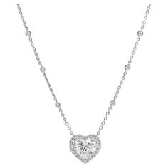 18KT WHITE GOLD MAGNIFICENT HEART SHAPE DIAMOND PENDANT WITH 5.34CST OF HEART SHAPE I SI1 GIA#6207841153 DIAMOND SET IN TO HALO SETTING WITH MICROPAVE ROUND DIAMONDS AND PUT ON A CHAIN WITH DIAMONDS By-The-Yard FEATURES 1.60CT OF ROUND DIAMONDS. Luxury Classic Diamond Heart Necklace, Luxury Heart-shaped Diamond Solitaire Necklace, Luxury Heart-shaped Solitaire Necklace For Formal Occasions, Heart Shaped Diamond Necklace, Heart Shaped Diamond Pendant, Diamond Pendent, Diamond Necklace Designs, Halo Setting, Heart Pendant Diamond