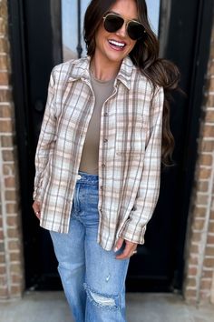 Step into style with our Long Plaid Print Button Down Shirt! Made from lightweight flannel, this versatile piece can be worn as a shacket or top for the perfect layered look. Get ready to turn heads and make a statement with this trendy and functional addition to your wardrobe. Fit: She is wearing her true size medium. Fits true to size. If in between sizes, size down. Plaid Shacket, Boutique Clothes, Cute Boutiques, Trendy Shirts, Running Tops, Plaid Print, New Arrival Dress, Layered Look, Cute Tops