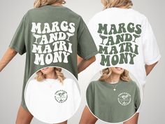 two women wearing matching tshirts with the words marcs and mary money printed on them