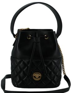 Indulge in the epitome of luxury with this stunning Versace Small Bucket Shoulder Bag, perfect for elevating any outfit. Crafted from sumptuous lamb leather and adorned with the iconic Medusa head logo, this bag is a symbol of style and elegance. Designed for versatility, it features a detachable chain and leather strap, allowing you to wear it elegantly on your shoulder or as a chic crossbody. Accented with gold-tone hardware, this bag seamlessly blends functionality with high fashion, making it a must-have accessory for your curated collection. Color: Black Material: Lamb Leather Country of origin: IT Top Handle: 35cm leather top handle Strap: 110cm removable chain and leather shoulder strap Measurements: L*H*W: 24cm*20cm*9cm Small Buckets, Medusa Head, Versace Bags, Leather Bucket Bag, Leather Bucket, Quilted Leather, Leather Top, Satchel Bags, Bottega Veneta