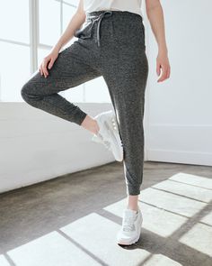 Our favorite performance joggers are a slim fit with the perfect amount of stretch for ultimate comfort. Thick drawstrings, cuffed ankles, and two pocket design give them a premium feel. Our Flowknit fabric is made from Global Recycle Standard poly yarn, which diverts and recycles plastics destined for landfill or the ocean, so you can feel and look good in what you wear.  | Quince | Women's Super Soft Performance Joggers in Heather Grey, Flowknit Activewear, Size Small, Recycled Polyester Gray Stretch Joggers With Elastic Waistband, Sports Relaxed Fit Drawstring Joggers, Gray Sportswear Joggers With Elastic Waistband, Gray Elastic Waistband Joggers, Relaxed Fit Drawstring Joggers For Sports, Relaxed Fit Workout Joggers With Drawstring, Sports Relaxed Fit Joggers With Drawstring, Gray Elastic Waistband Joggers For Sportswear, Relaxed Fit Sweatpants With Drawstring For Workout