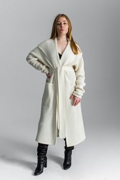 "White cardigan Light coat Oversized cardigan Chunky sweater Basic clothing Chunky loose knitwear Long coat Minimal clothing Kimono cardigan One size fits for XS-M/L Free shipping worldwide This item can be made in any size and color (1-2 weeks for production). Contact us, and we will advice about color availability and measures required. The wool is machine washable with program of \"wool\" or \"delicate\" Low temp. 30o Designed & Created by Gurenkova Knitwear" Oversized Long Outerwear In Winter White, Oversized Long Cozy Outerwear, Cozy Oversized Long Outerwear, Oversized Winter White Cardigan For Winter, Cozy Long-length Cardigan For Spring, Long Winter Sweater, Beige Sweater Coat For Winter Daywear, Oversized Long Chunky Knit Outerwear, Oversized Open Front Knit Cardigan