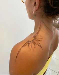 a woman with a tattoo on her back