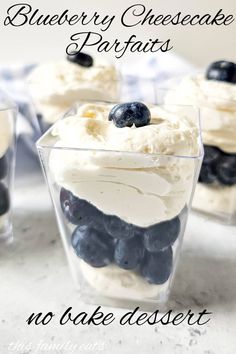 blueberry cheesecake parfaits with whipped cream and berries in a glass dish