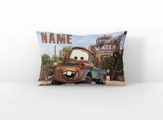 a pillow with the character mater mater from disney pixama and name on it