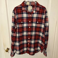 American Eagle Flannel Shirt Size Large In The Colors White, Red, And Blue. Can Fit Sizes Small-Smaller Xl. Was Originally In The Women’s Section But Could Fit To Be A Smaller Men’s Flannel As Well. This Flannel Is Very Flattering And Comfortable To Wear. There Is A Small Spot On The Inside Of The Back Of The Neck (Picture 4) Where There Is Slight Discoloration, It’s Barely Noticeable. Was Bought Brand New For $45 And Only Worn A Couple Of Times. In Great Condition With No Stains, Smells, Rips, Red Cotton Flannel Long Sleeve Shirt, Red Cotton Long Sleeve Flannel Shirt, Red Long Sleeve Cotton Flannel Shirt, Red Flannel Long Sleeve Top, Red Cotton Flannel Shirt For Fall, Red Flannel Top For Fall, Red Long Sleeve Flannel Shirt, Red Flannel Collared Shirt, Red Flannel Shirt For Fall