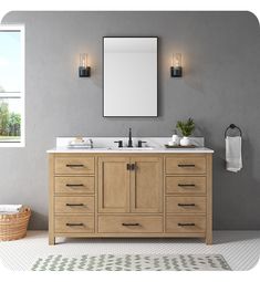 a bathroom vanity with two sinks and a large mirror on the wall next to it