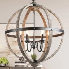 a wooden orb chandelier hanging from the ceiling