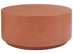 an orange round table with speckles on it