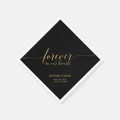 a black and gold foiled square with the words forever in our hearts on it