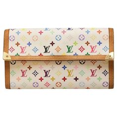 Murakami limited edition wallet with iconic LV multicolor Monogram ! Condition : good, the exterior is in very good condition but traces are visible on the inside coin pocket Made in France Material : coated canvas, leather Interior : leather Color : white, multicolor Monogram Dimensions : 19 x 11 x 1.5 cm Serial number: TU0023... Year : January (week 3) 2003 Hardware : gold-plated metal Details : This Monogram Multicolore wallet is a limited edition resulting from the collab between Louis Vuitt Luxury Multicolor Wallet For Daily Use, Designer Multicolor Wallets With Card Slots, Luxury Multicolor Leather Wallets, Luxury Multicolor Wallets With Card Slots, Luxury Multicolor Wallets For Travel, Designer Multicolor Travel Wallet, Multicolor Bifold Wallet For Travel, Multicolor Bifold Travel Bag, Multicolor Bifold Wallets For Travel