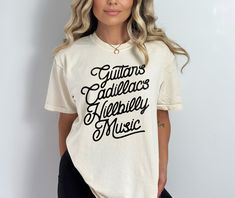 Guitars Cadillacs Hillbilly Music Shirt - Western Graphic Tee, 90s Country Shirt, Country Aesthetic, Dwight Yoakam Shirt, Concert Shirt ✦ Fit + Quality ✦ These unisex Comfort Colors tees are like a well-loved favorite - wash well and are easy to wear! ✦ 100% ringspun cotton ✦ Preshrunk, soft-washed, garment-dyed fabric ✦ Twill taped shoulder-to-shoulder ✦ Set-in sleeves ✦ Double-needle stitched sleeves and bottom hem ✦ 1" ribbed collar with double-needle topstitched neckline Washing & Drying Instructions: ✦ Turn inside out. ✦ Wash with cold/warm water. ✦ Do not use bleach. ✦ Don't recommend tumble dry, hang dry or lay flat to dry. ✦ Returns + Shipping ✦ We print on demand and custom print products - because of this, we are not accepting returns. If there are any defects or issues with your Country Music Shirts Casual, Luke Combs Shirt Concert, Country Music Tee Shirts, 90s Country Aesthetic, Distressed Band Tee, Country Concert Shirts, Country Girl Shirts, 90s Country, Retro Band