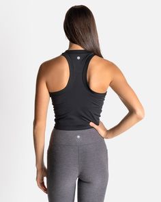 If you love our Bella Ribbed Tank, then say hello to the CROPPED Bella Ribbed Tank. Just a little extra crop for those who like a shorter length in their tank. This fabric has lots of stretch, so it will never chafe and will always keep you feeling cool, confident, and comfortable. With a racerback cut, no cups or removable shelf bra—so you can wear this tank over any workout bra you choose—it’s also incredibly versatile in a variety of activities. Black Stretch Crop Top With Built-in Bra, Fitted Racerback Crop Top With Built-in Bra, Stretch Black Crop Top With Built-in Bra, Snug Fit Sleeveless Tops With Built-in Bra, Functional Sleeveless Crop Top With Built-in Bra, Functional Cropped Top With Built-in Bra, Black Seamless Cropped Crop Top, Black Stretch Bra-friendly Crop Top, Black Seamless Tank Crop Top