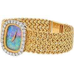 Journey through the narrative of luxury and design with this exquisite 18K Yellow Gold Opal Dial Vintage Watch from Tiffany & Co. A true embodiment of timeless elegance, this watch features a mesmerizing opal dial that captures the essence of sophistication and allure. The intricate craftsmanship is evident in every detail, from the round diamonds adorning the bezel to the signature Tiffany & Co. design that exudes prestige and style.Crafted with precision and care, this vintage watch showcases the perfect balance of vintage charm and modern functionality. The Swiss-made quartz movement ensures accurate timekeeping, while the 18K yellow gold construction adds a touch of luxury and durability. The watch is adorned with a crown set with opal, adding a unique and captivating element to its ov Opal Birthstone, Co Design, Estate Jewelry, Tiffany & Co., Vintage Watches, Vintage Charms, Quartz Movement, Round Diamonds, Timeless Elegance