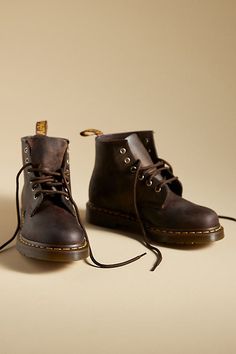 The Dr. Martens 101 Boots are made from a heavyweight leather that looks beaten up and worn-in from the first step – and only gets better with age. | 101 Smooth Leather Boots by Dr. Martens in Brown, Women's, Size: 8, Leather/Rubber at Anthropologie Vintage Boots With Waxed Finish And Round Toe, Vintage Lace-up Oiled Leather Boots, Vintage Leather Boots With Waxed Finish, Vintage Oiled Leather Boots With Waxed Finish, Vintage Brown Oiled Leather Work Boots, Vintage Oiled Leather Work Boots With Round Toe, Rustic Oiled Leather Work Boots With Round Toe, Vintage Lace-up Oiled Leather Work Boots, Vintage Oiled Leather Boots With Round Toe