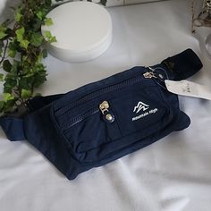 Great Fanny Pack Navy Blue In Color Nylon Fabric Black Interior Front ,Top And Back Zipper Pockets Adjustable Strap Nwt Sporty Navy Blue Fanny Pack Trail Unisex Casual Urban Camping Hiking Everyday Urban Camping, Daypack Backpack, Tory Burch Crossbody, Fall Handbags, Brown Leather Bag, Coach Shoulder Bag, Fabric Black, Nylon Fabric, Black Purses