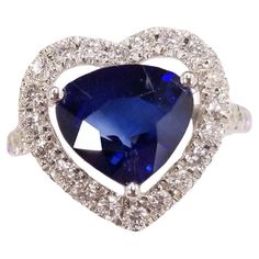 Introducing a magnificent piece of jewelry, this IGI certified ring is a true epitome of elegance and beauty. Crafted in 18K white gold, it features a stunning 3.15 carat intense blue sapphire in a captivating pear shape at its center. The intense blue hue of the sapphire exudes sophistication and adds a touch of regality to the design. Surrounding the pear-shaped sapphire is a mesmerizing halo of 0.67 carat round diamonds. These sparkling diamonds are precisely set to enhance the brilliance of Elegant Gia Certified Trillion Cut Ring, Luxury Gia Certified Diamond White Sapphire Ring, Exquisite Sapphire Diamond Ring Gia Certified, Exquisite Gia Certified Sapphire Diamond Ring, Elegant Gia Certified Pear-shaped Sapphire Ring, Luxury Trillion Cut Sapphire Ring For Formal Events, Luxury Trillion Cut Sapphire Ring For Formal Occasions, White Gold Trillion Cut Sapphire Ring For Formal Occasions, Formal White Gold Sapphire Ring Trillion Cut