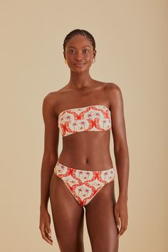 Embrace the vibrancy of summer with the FARM Rio Summer Beach Bikini Bottom. Its vivacious red and white pattern draws inspiration from tropical havens, making every moment feel like a sunny escape. The flattering high-leg cut and comfortable mid-rise waist complement your natural silhouette, while the playful tie-back detail on the coordinating top adds a touch of whimsy to your beach ensemble. Ideal for those who love to stand out with a touch of Brazilian flair. Composition 85% POLYAMIDE 15% ELASTANECare Instructions MAXIMUM WASHING TEMPERATURE 30°C, MILD PROCESS, DO NOT BLEACH, TUMBLE DRYING POSSIBLE, DO NOT IRON, DO NOT DRY CLEANSize and Fit Inches XXS XS S M L XL Bust N/A N/A N/A N/A N/A N/A Waist 22 25 27 28 30 31 Length N/A N/A N/A N/A N/A N/A Hip 34 37 39 40 43 43 Tropical Swimwear For Beach Party During Resort Season, Summer Tropical Print Swimwear For Sunbathing, White Swimwear For Poolside During Beach Season, Tropical Floral Print Swimwear For Summer Outings, White Swimwear For Vacation Swimming, Palm Tree Print Beachwear For Summer, Summer Tropical Print Swimwear, Tropical Print Summer Swimwear For Vacation, Summer Palm Tree Print Swimwear For Poolside