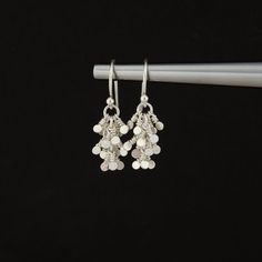 This extremely sweet and unique pair of Silver Tassel Dangle Earrings are handcrafted for you with great care. The earrings are handmade and hammered from fine 925 Sterling Silver or 14K Gold Filled. They are lightweight and dainty, perfect for everyday wear!  MATERIALS AND SIZE  ◆ Metal - 925 Sterling Silver, 14K Gold Filled ◆ Earrings measure approx. 26 mm / 1.02 inches from the top of the ear wire ◆ All earrings with French ear wires come with silicone ear backs for extra protection LINK TO T Silver Long Drop Tassel Earrings As Gift, Silver Long Drop Tassel Earrings For Gift, Minimalist Dangle Tassel Earrings For Gift, Minimalist Dangle Tassel Earrings As Gift, Minimalist Earrings With Dangling Beads As Gift, Handmade Silver Dangle Tassel Earrings, Handmade Silver Drop Cluster Earrings, Silver Nickel-free Tassel Earrings As Gift, Silver Tassel Earrings With Dangling Beads For Gift