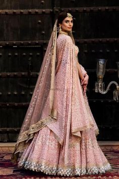 a woman in a pink bridal gown